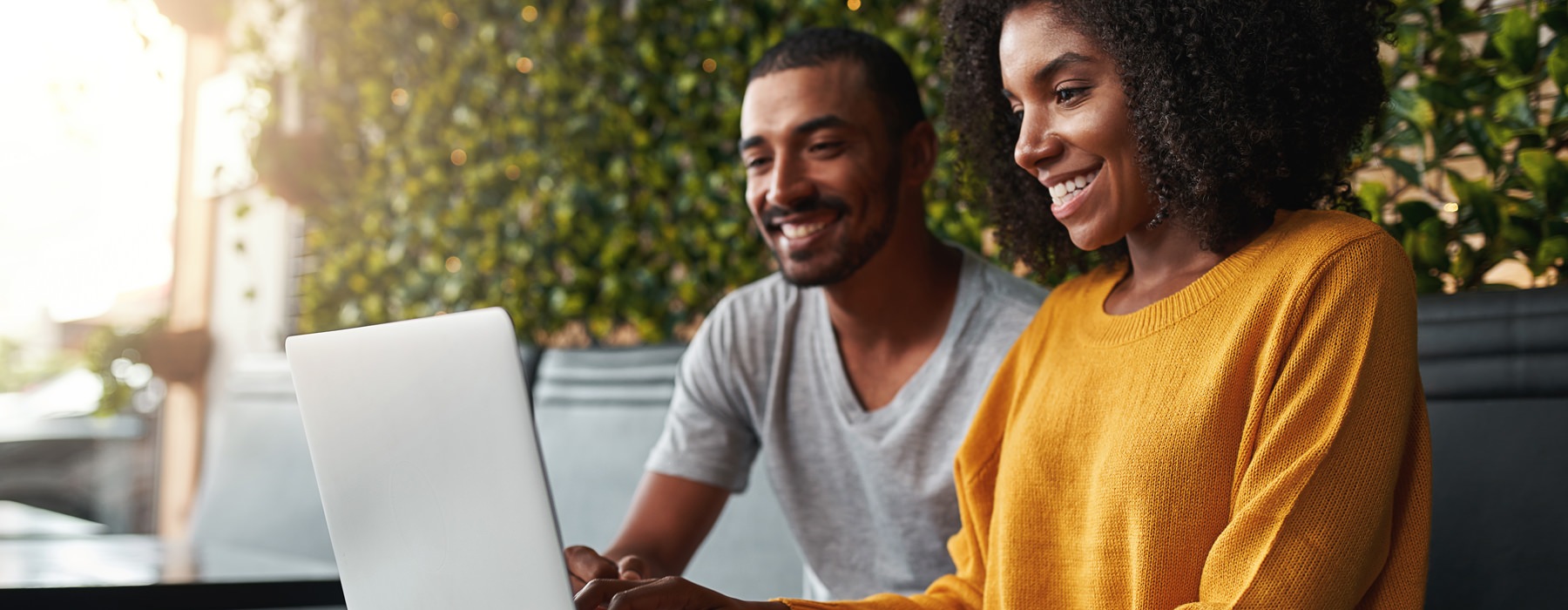 man and woman on a computer